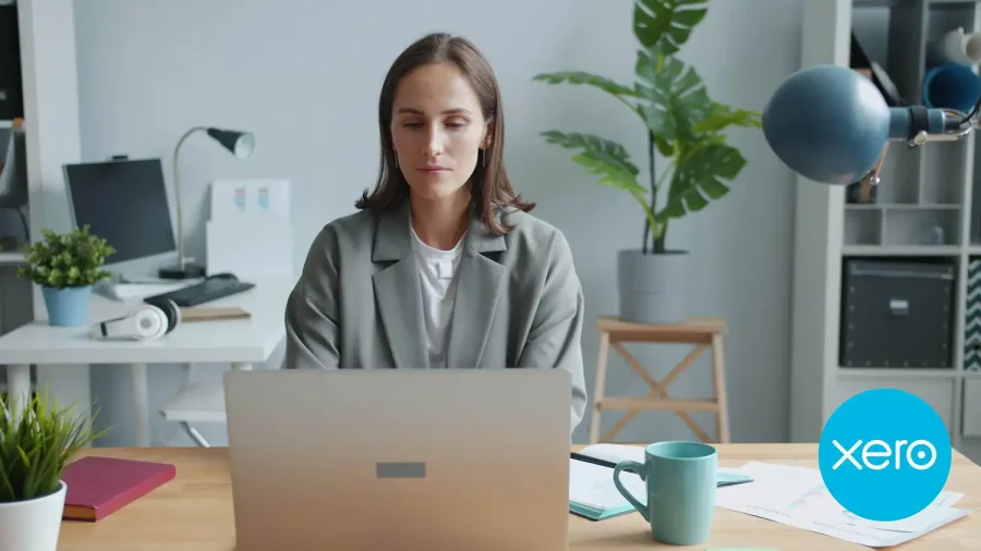 Business owner working in Xero accounting software on a laptop